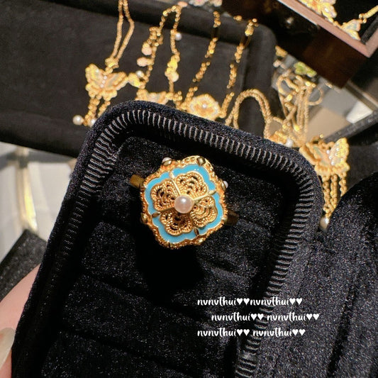 Ancient style golden filigree enameled butterfly-shaped lucky charm necklace with Chinese knot design. New Chinese style. Butterfly.