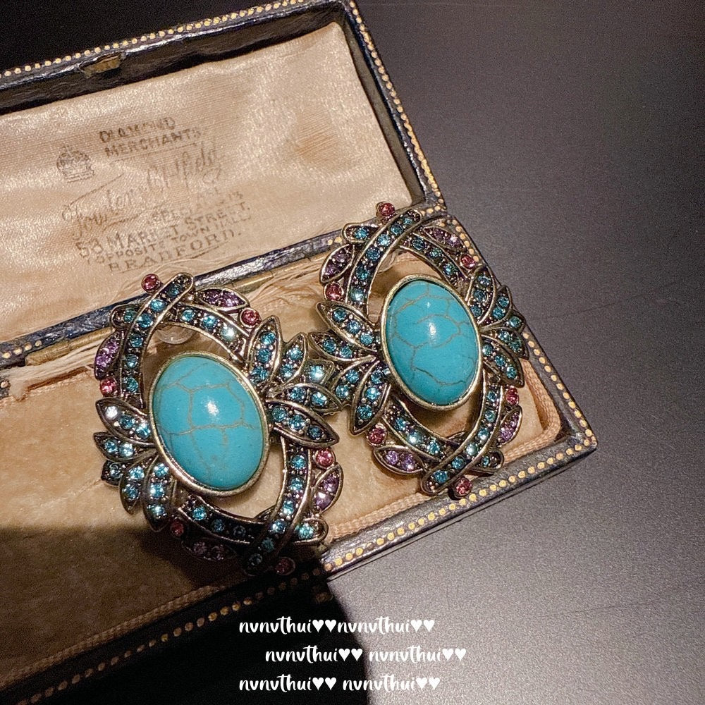 Italian vintage relief petal greenstone teardrop earrings, Sotheby's, royal teardrop bluestone earrings